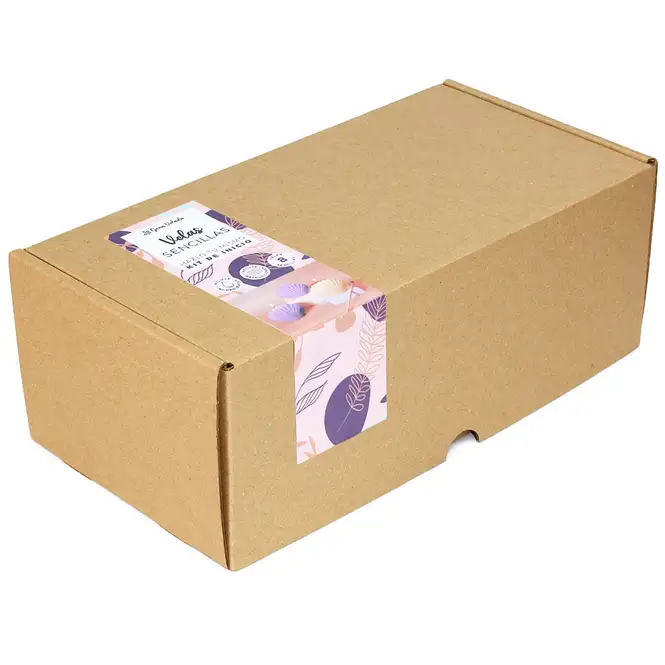 Materiales del kit de velas marinas: cera, mechas, colorantes y molde de concha